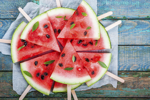 Slices of fresh juicy watermelon on a paper closeup