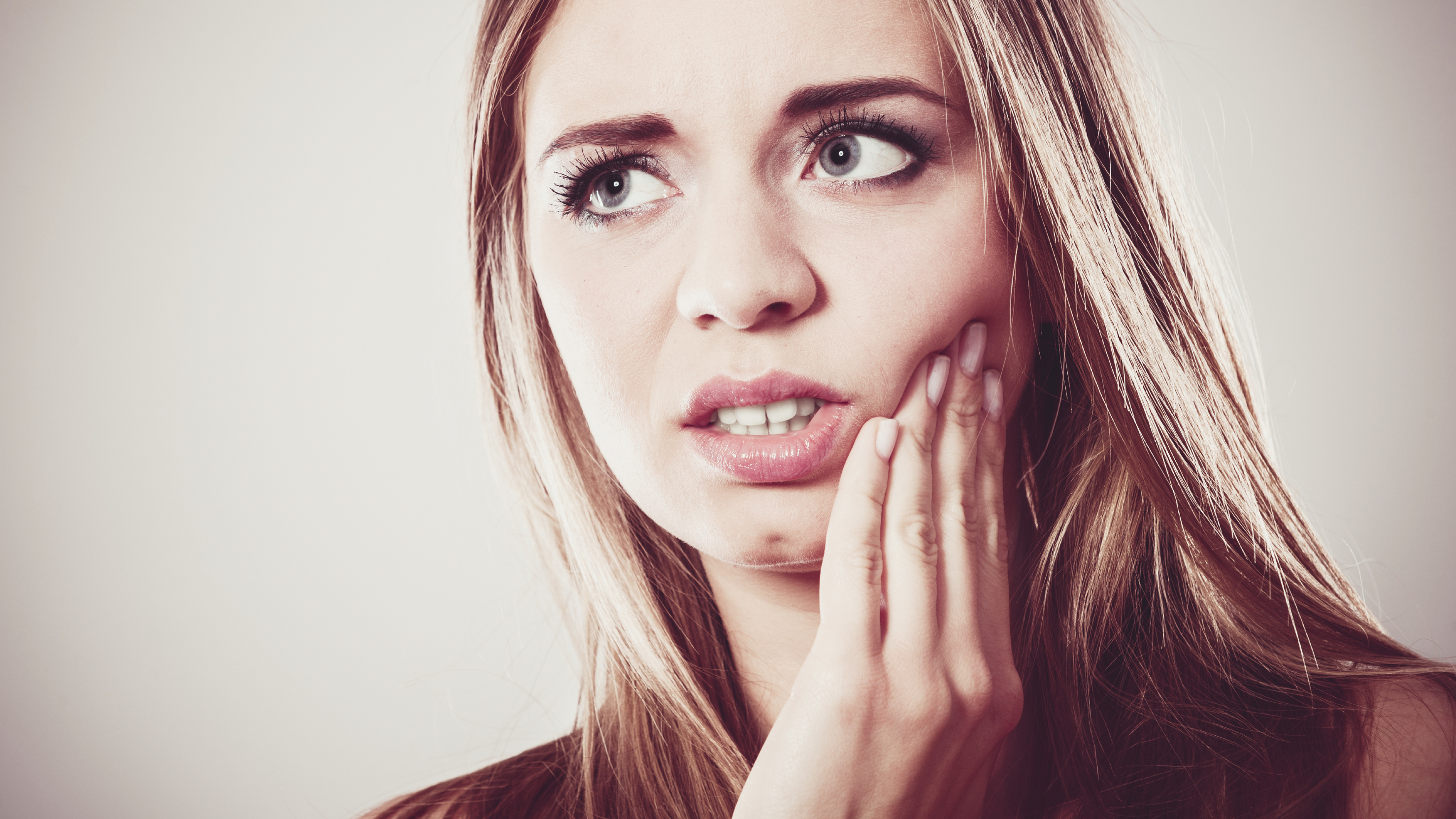 Toothache. Woman suffering from tooth pain