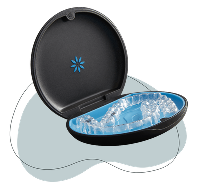 Black portable cooler with lid open revealing ice inside, blue accent design.